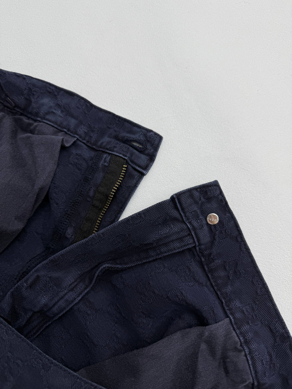 Navy Gucci pants zipper and waistband lining detail, GG fabric pattern