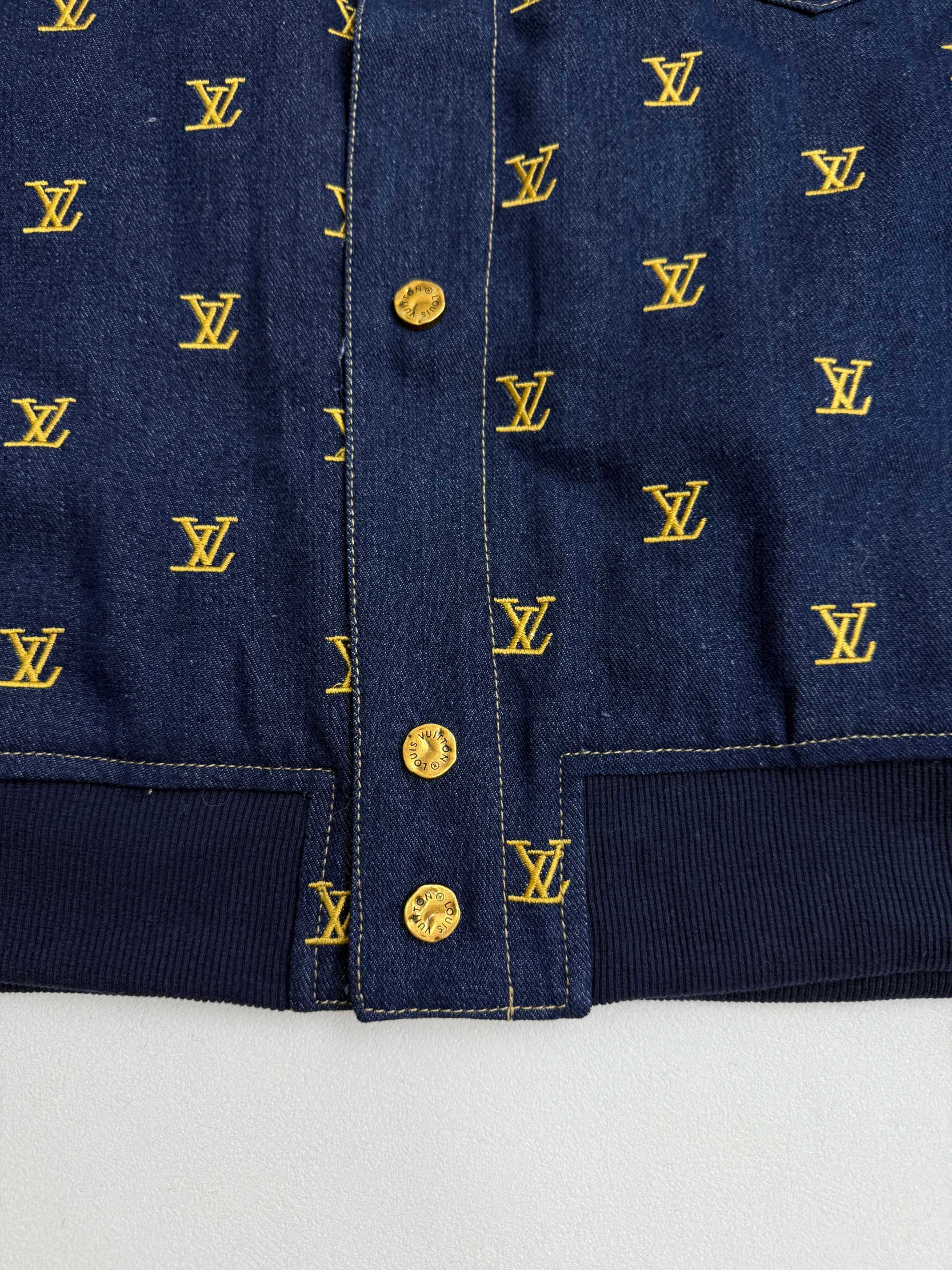 Louis Vuitton denim jacket front placket with gold buttons and yellow monogram