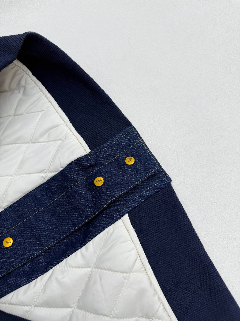 Louis Vuitton denim jacket with quilted white lining at shoulder and rib trim