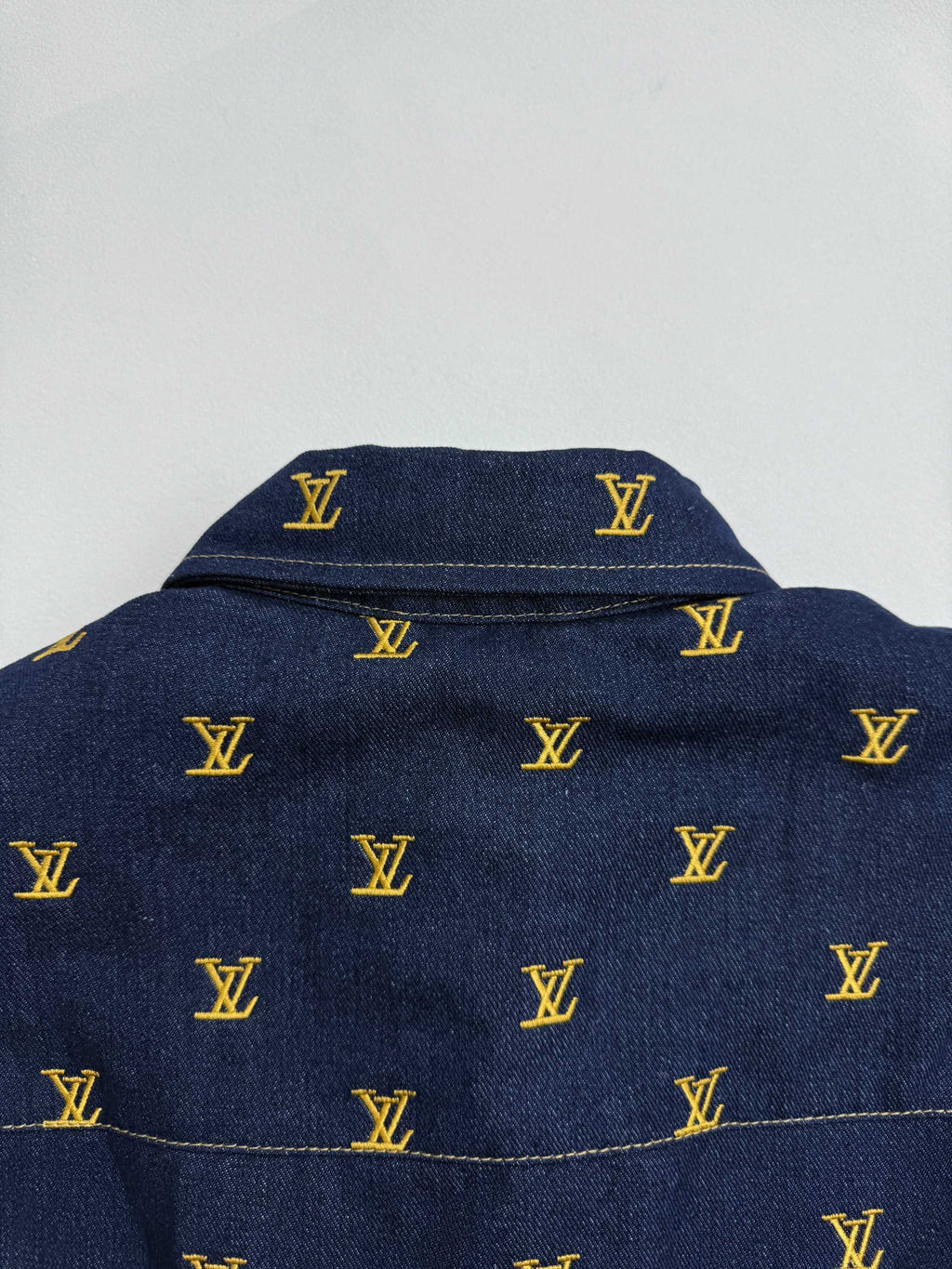 Louis Vuitton denim jacket upper back yoke with yellow monogram pattern