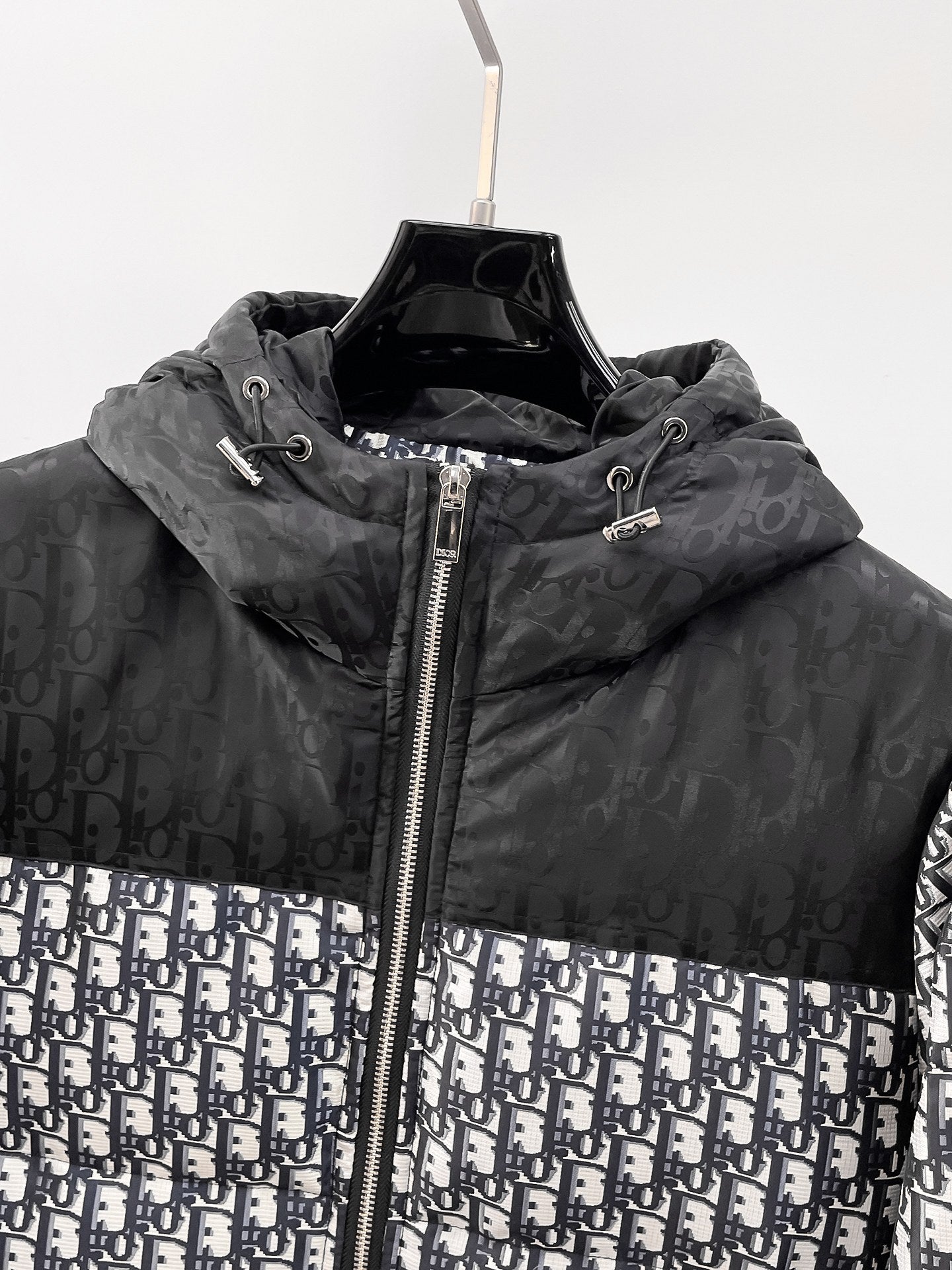 Dior hooded puffer jacket neckline with adjustable drawstring and silver zipper