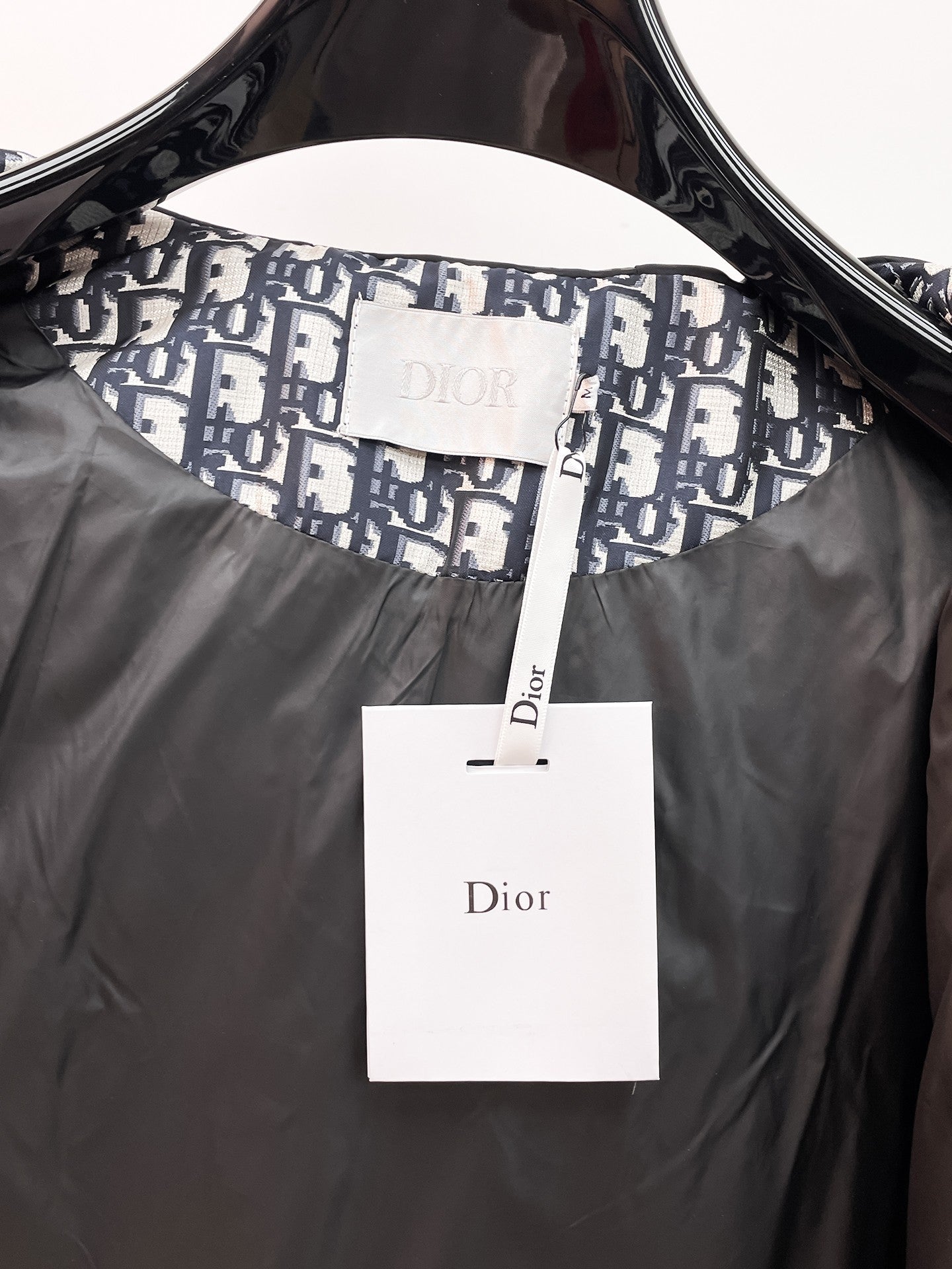 Dior hooded jacket collar with inner logo lining and white Dior tag