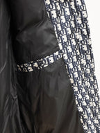 Long black Dior garment with blue-and-white logo panel
