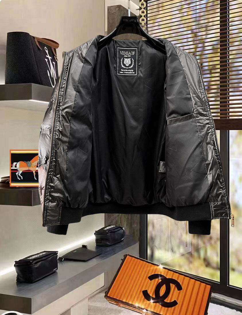 Black puffer jacket with hood, back view, logo label at neckline