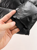 Burberry long puffer jacket, dark shiny black, cuff area with elastic trim.