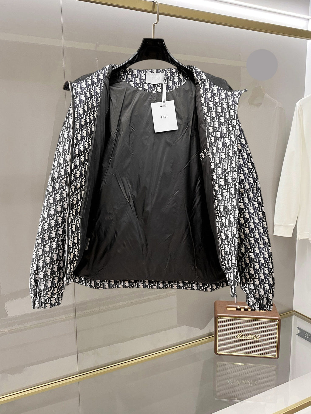 Dior long hooded jacket with open front showing black interior lining