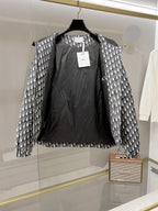 Dior long hooded jacket with open front showing black interior lining