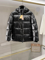 Burberry long puffer jacket, dark shiny black, full front zip, stand collar, hoodless.
