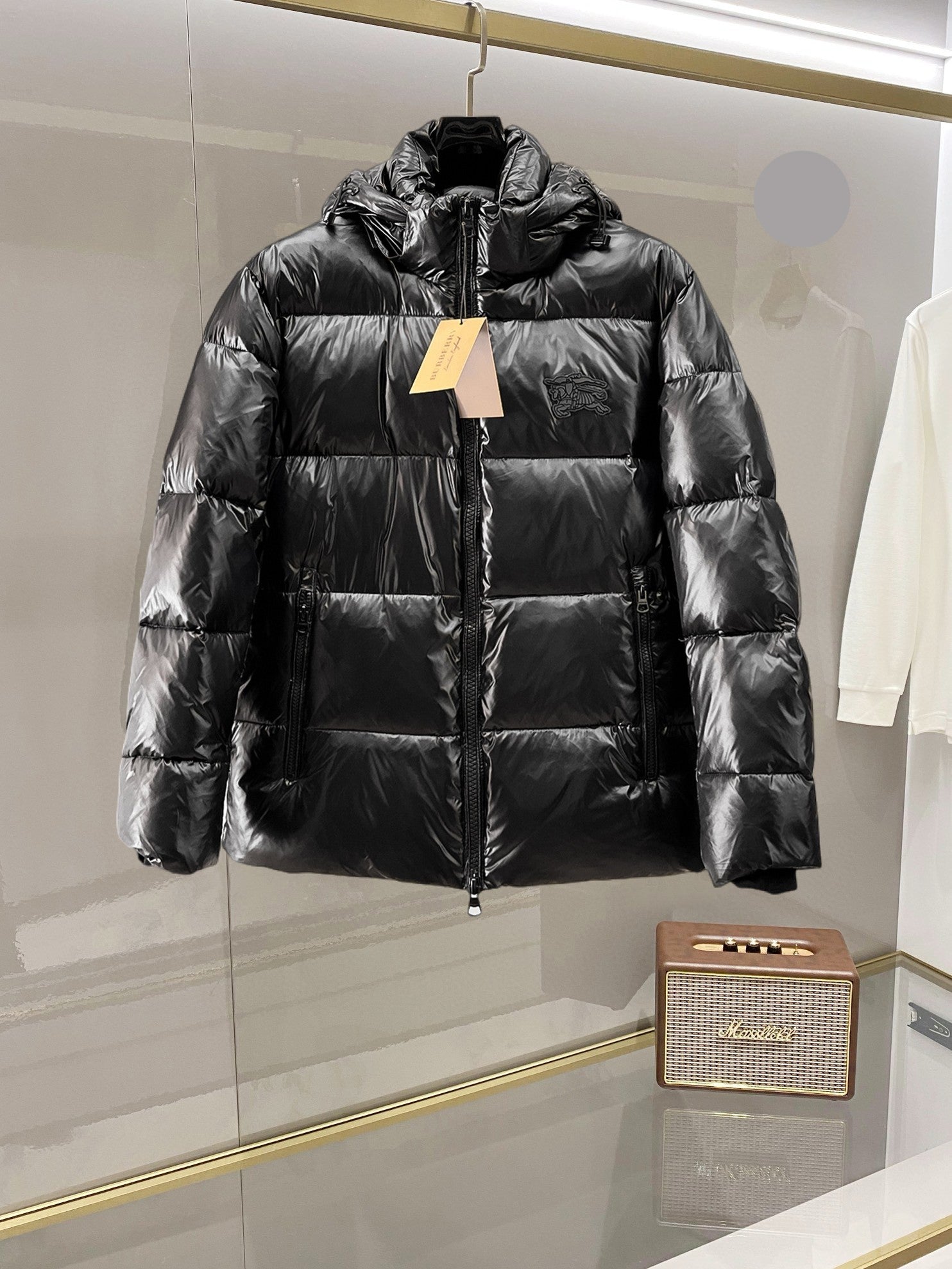 Burberry long puffer jacket, dark shiny black, full front zip, stand collar, hoodless.