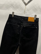 Black denim pants with two front pockets and subtle LV monogram hem band