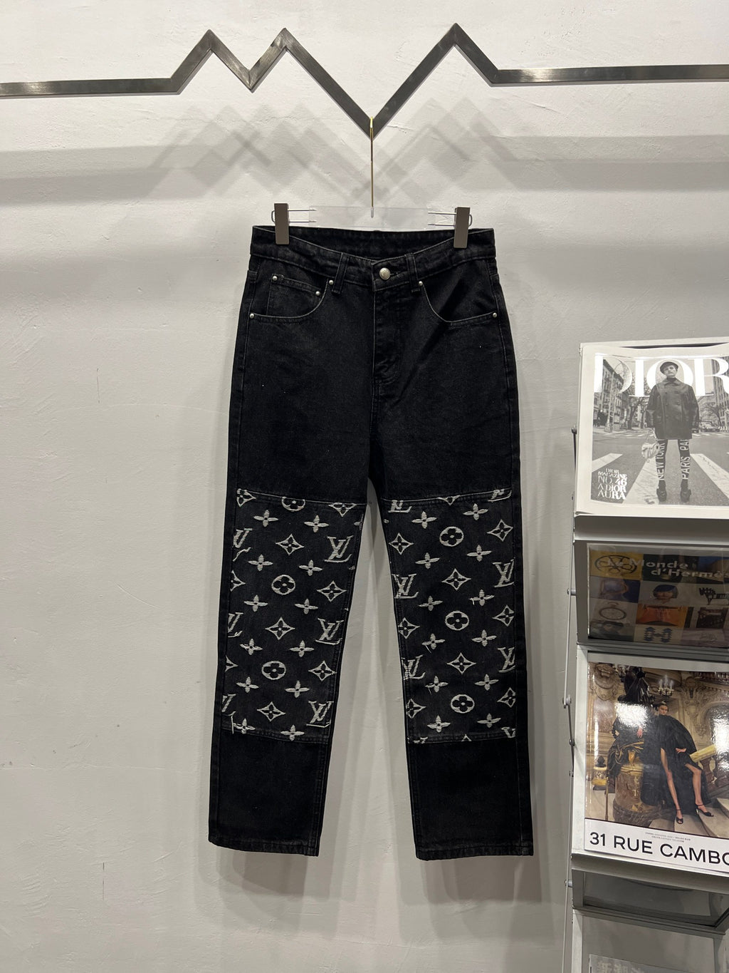 Black denim pants with LV monogram print panels on the lower legs