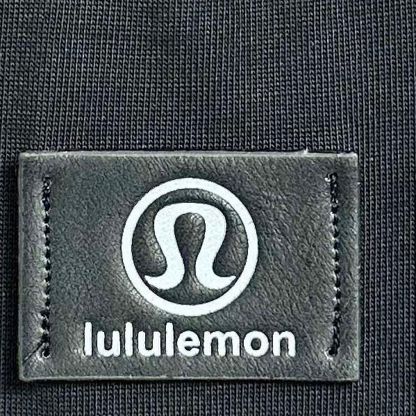 lululemon brand label on dark sweatshirt fabric