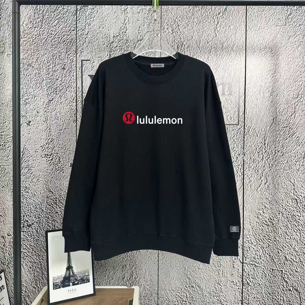 Black crewneck sweatshirt with lululemon logo at chest