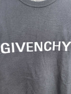 Dark sweatshirt with large white GIVENCHY lettering across the chest