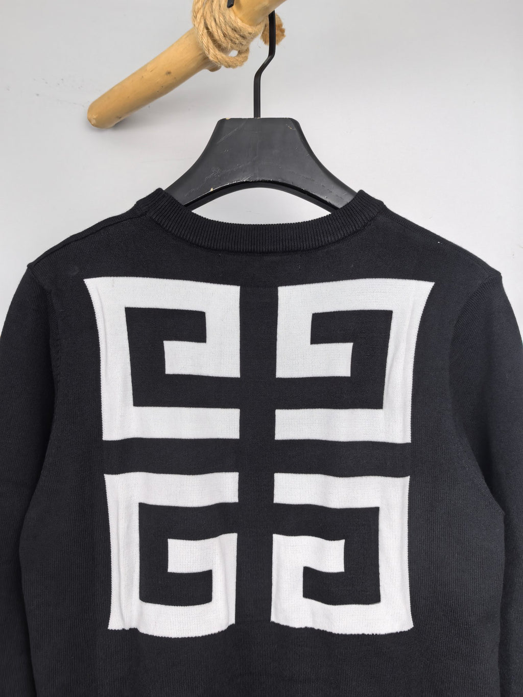 Dark Givenchy crewneck sweatshirt with large white geometric back logo