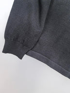 Dark sweatshirt ribbed cuff and knit sleeve seam detail