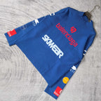 Blue long-sleeve sweater laid flat with SKWEAR graphic and red balenciaga logo