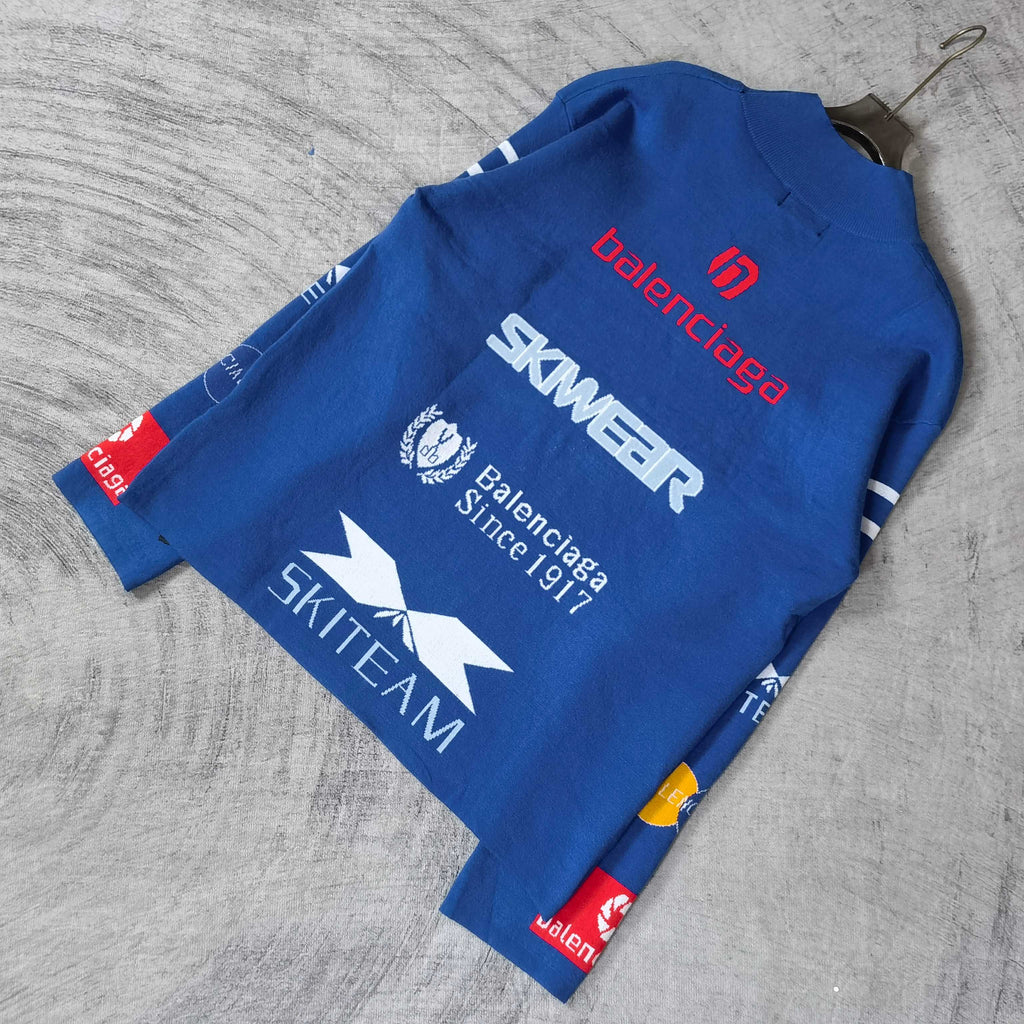 Blue sweater with SKWEAR, Balenciaga Since text, and star logo print