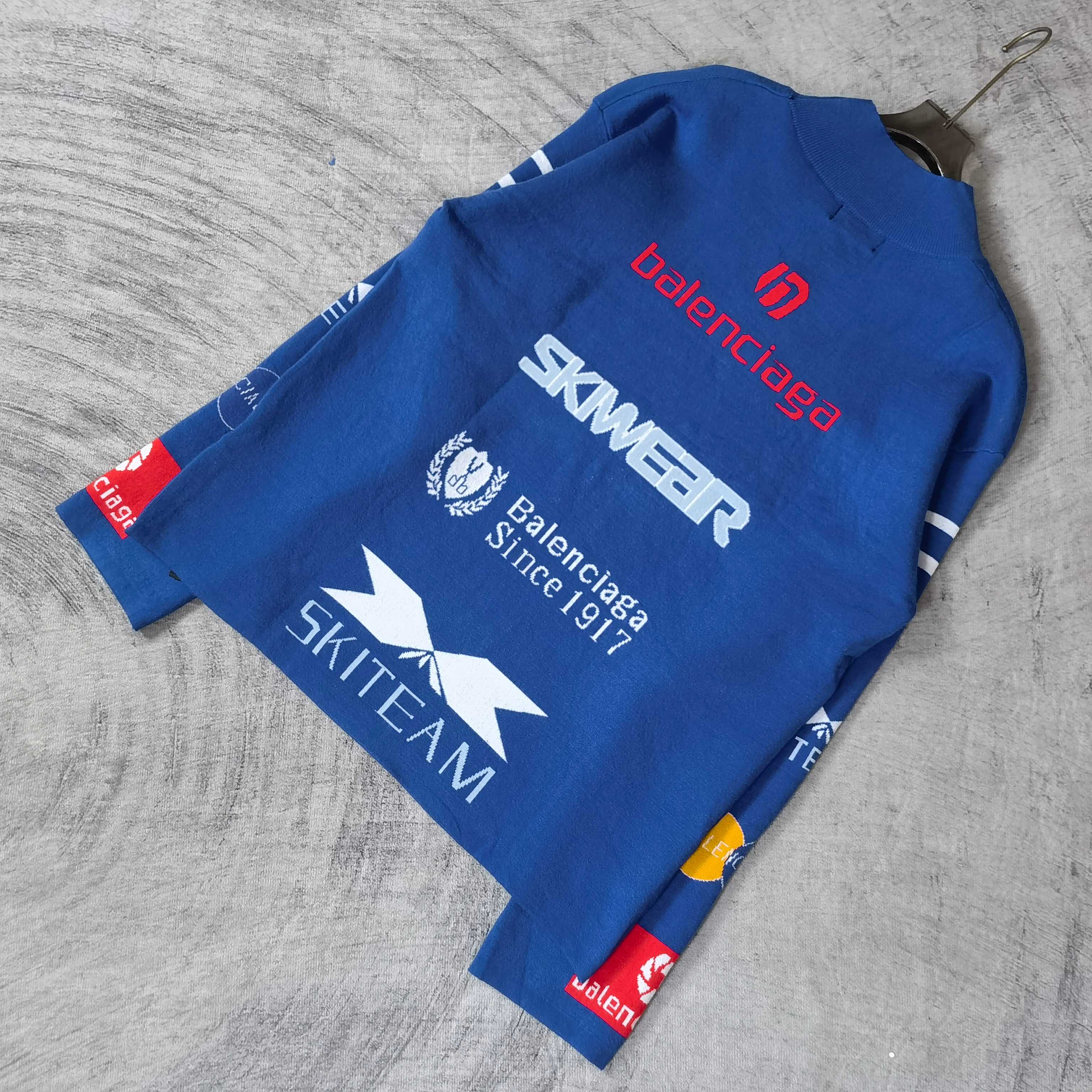 Blue sweater with SKWEAR, Balenciaga Since text, and star logo print