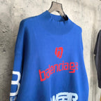 Blue sweater with red balenciaga logo and white SKWEAR graphic across chest