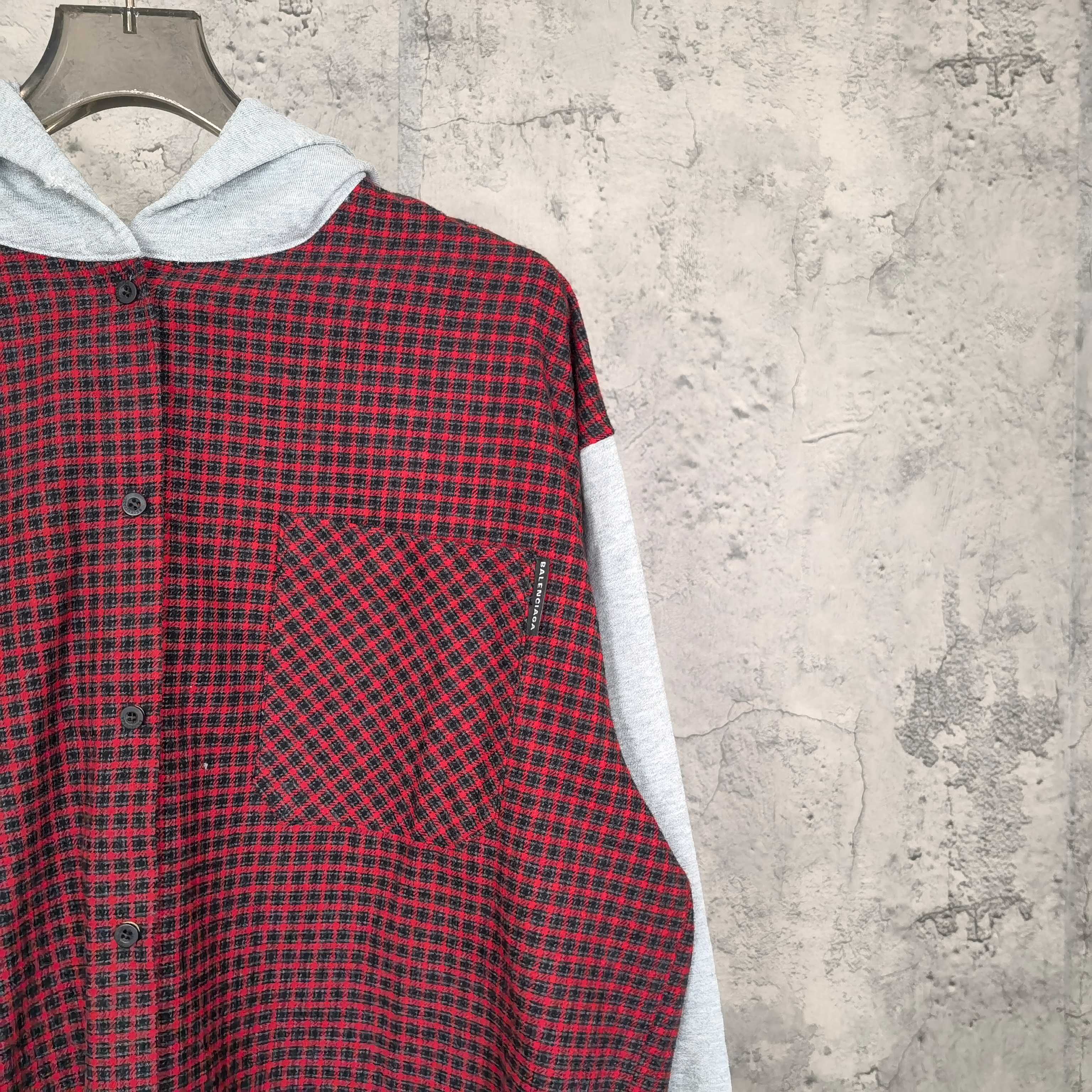 Red and black check button-front hoodie with light gray sleeve trim