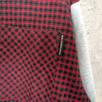 Balenciaga label on red and black check fabric