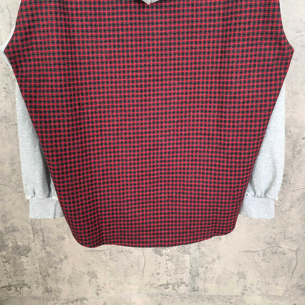 Long-sleeve plaid top in red and black with light gray sleeve cuffs