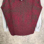 Long-sleeve plaid top in red and black with light gray sleeve cuffs