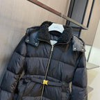 Long black puffer coat with dark fur collar and snap shoulder buttons