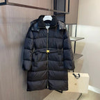 Long black puffer coat with faux-fur hood and front zipper