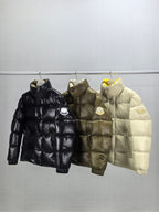 Three Moncler puffer jackets on hangers: black, olive, and light, front view