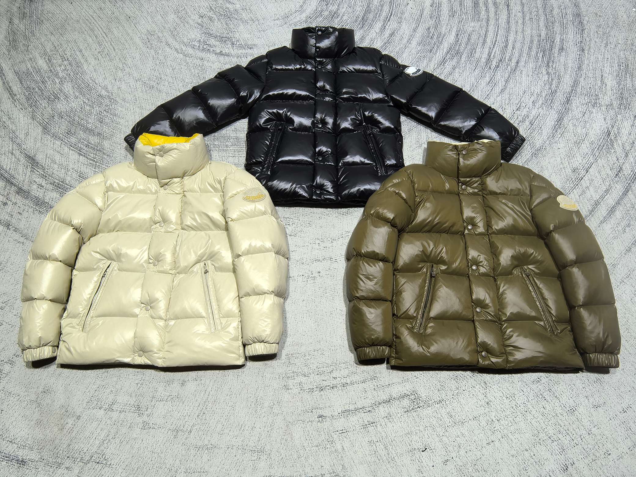 Moncler puffer jacket pair: light yellow and olive, quilted front view