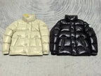 Moncler puffer jacket pair: cream and black, quilted padded fronts