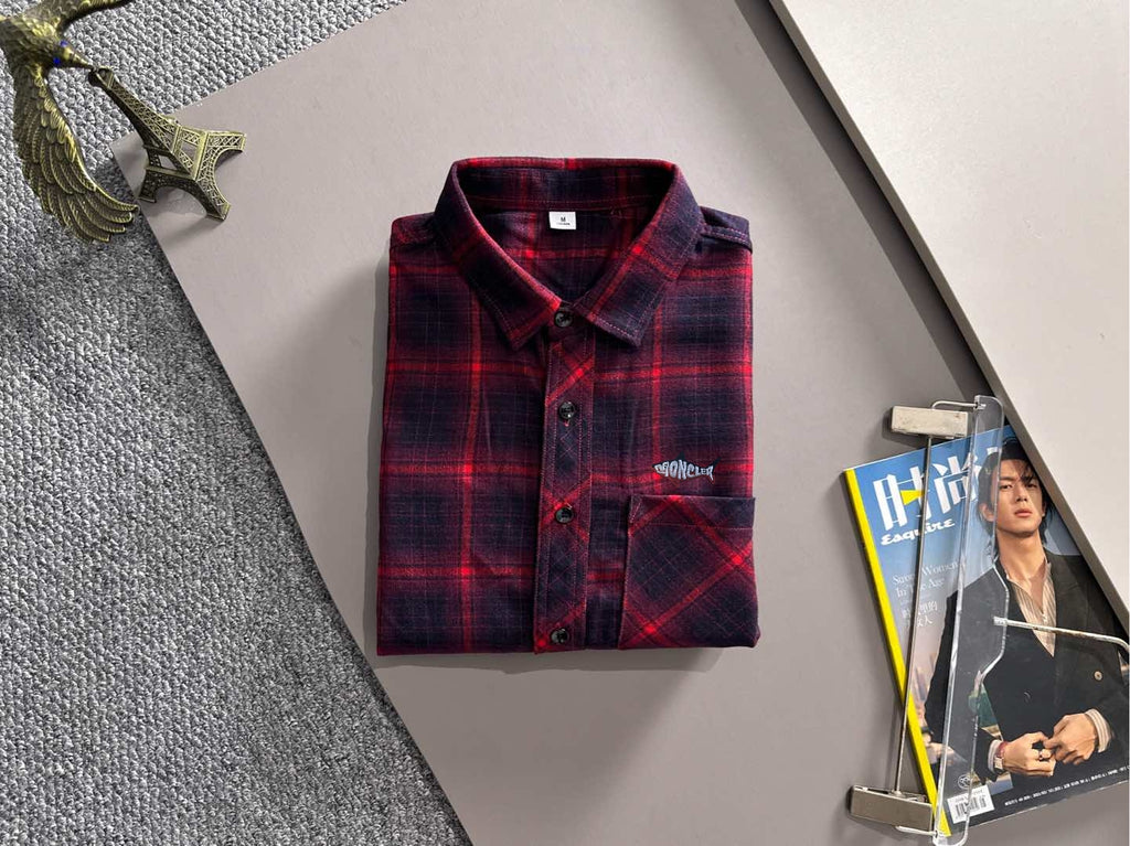 Long-sleeve plaid shirt on display, red and dark blue, button front and logo