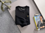 Fendi black long-sleeve sweatshirt on hanger, textured front panel and logo badge