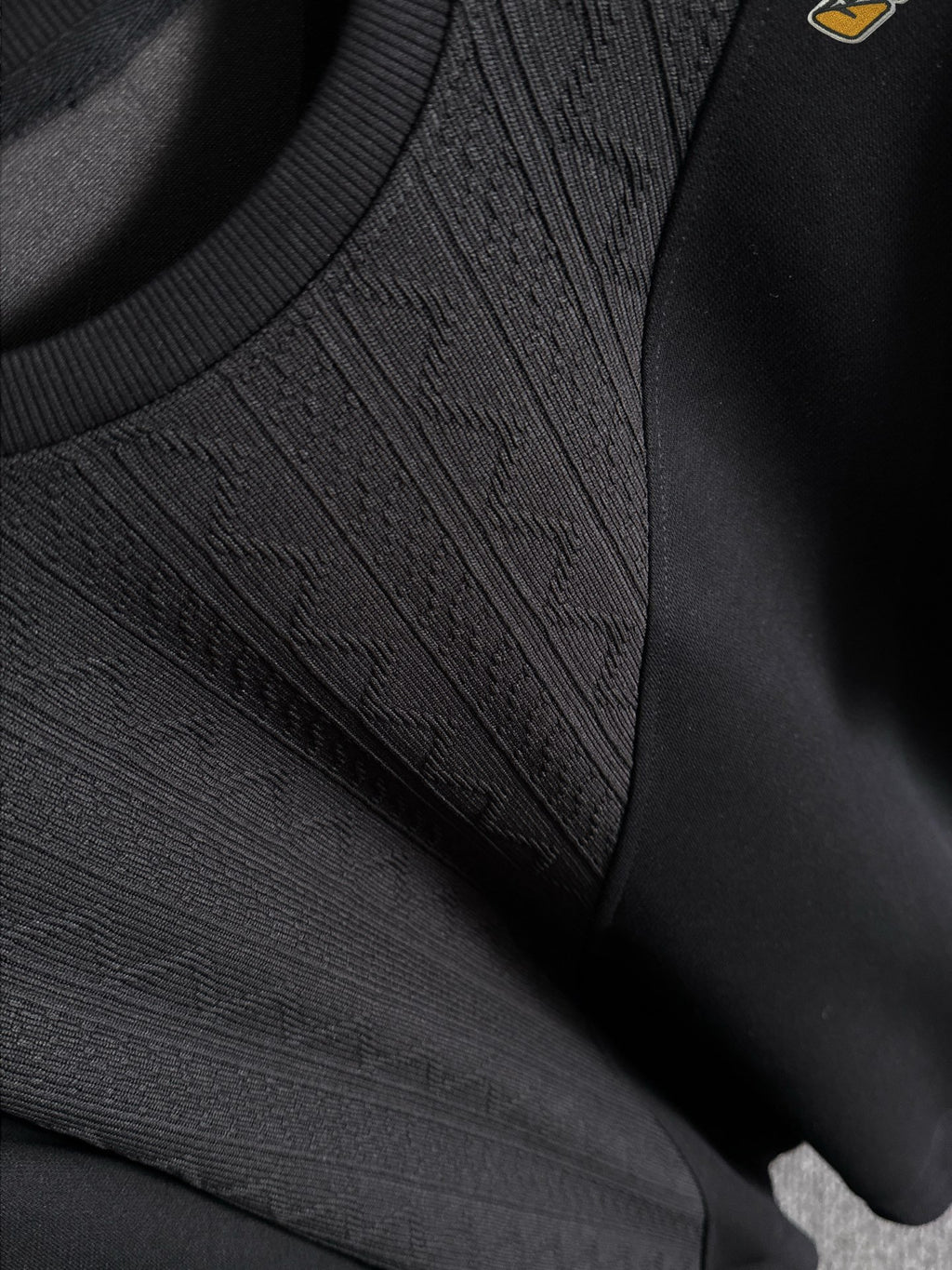 Fendi black long-sleeve sweatshirt close-up of textured knit front panel