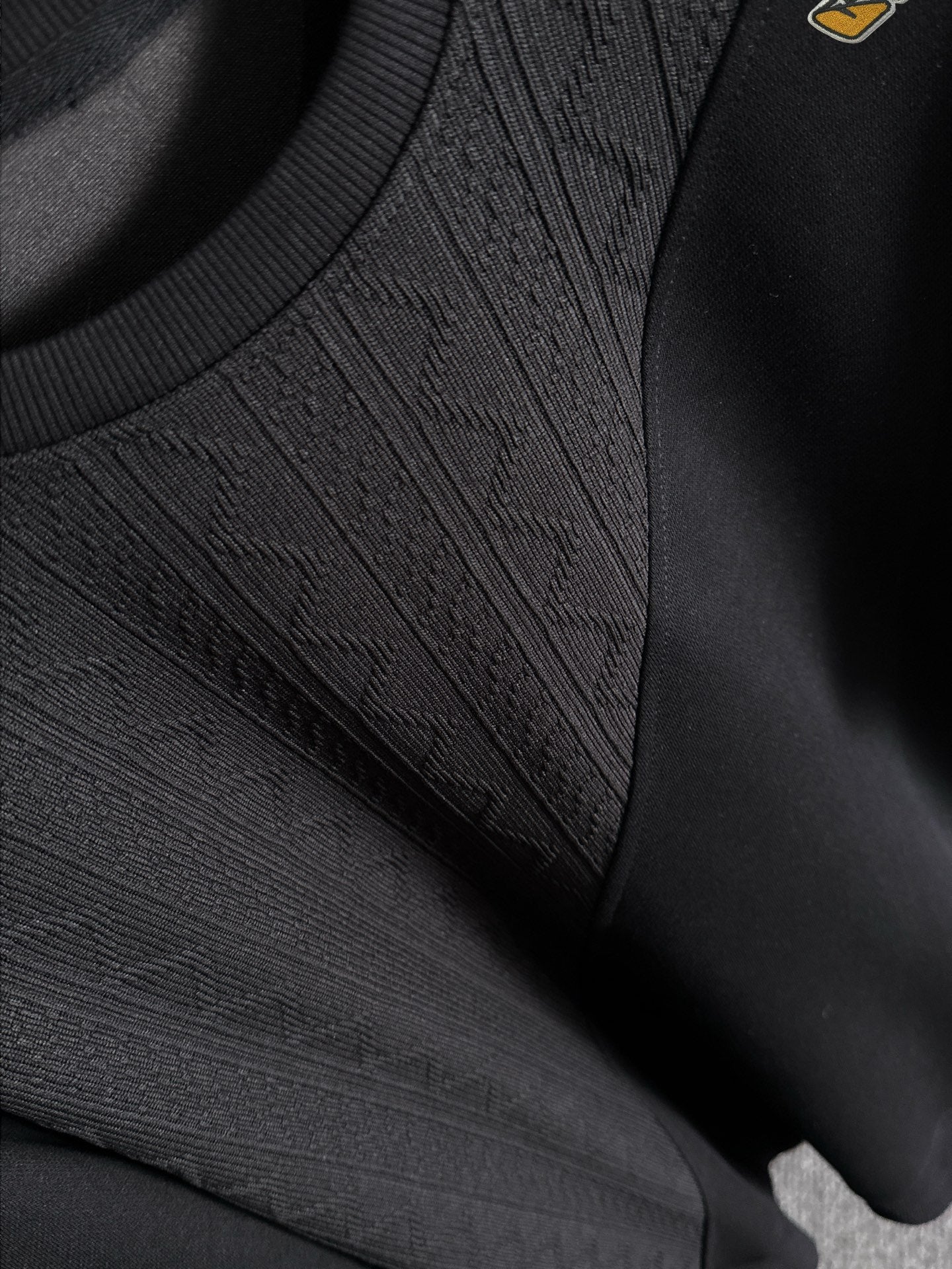 Fendi black long-sleeve sweatshirt close-up of textured knit front panel