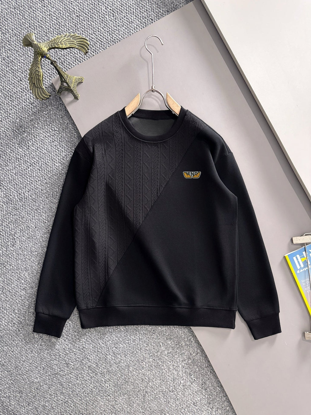 Fendi black long-sleeve crewneck sweatshirt with textured front and small logo patch