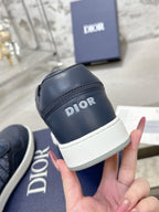 Unisex sneaker side detail with DIOR logo strap and white rubber sole