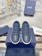 Unisex low-top sneakers in dark blue with lace-up front and white rubber sole
