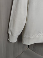 Light cream long-sleeve sweatshirt with ribbed cuffs