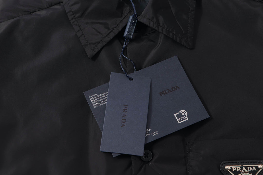 Black Prada button-up shirt with hanging product and care tags
