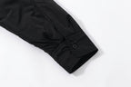 Black Prada button-up shirt sleeve cuff with button closure