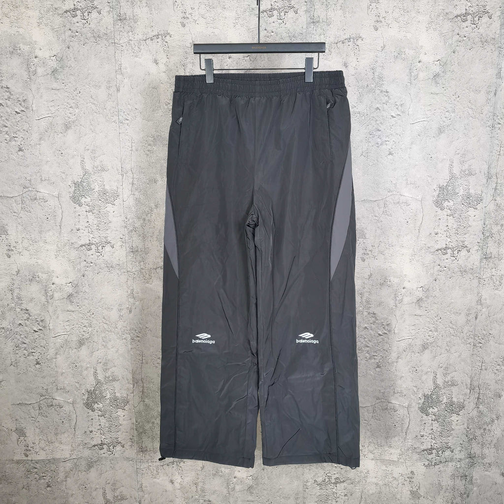 Black pants with elastic waistband and Balenciaga logo on the left leg
