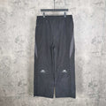Black pants with elastic waistband and Balenciaga logo on the left leg