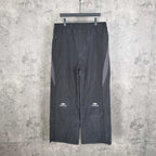 Black pants with elastic waistband and Balenciaga logo on the left leg