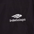 Close-up of Balenciaga logo on black pants fabric