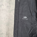 Black pants with side stripe seam and Balenciaga logo on leg