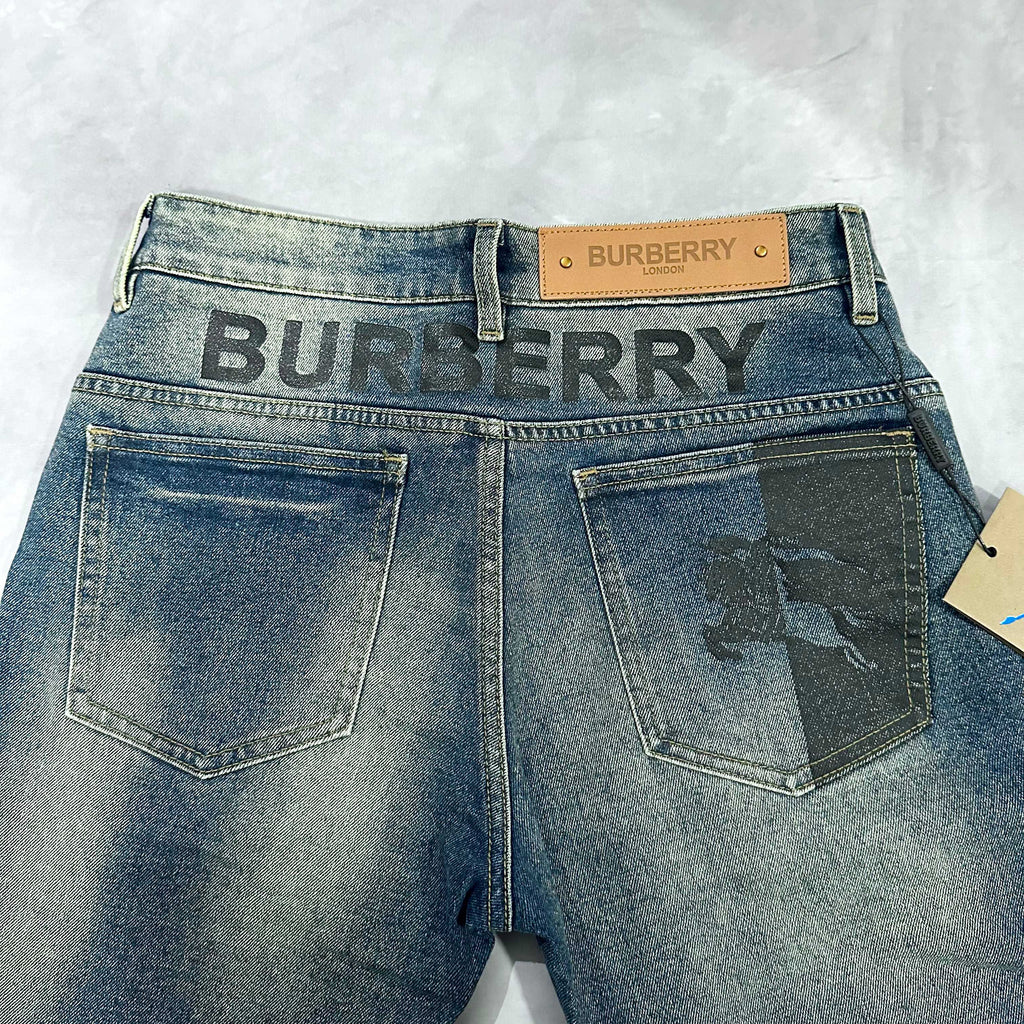 Burberry blue denim jeans front with large patch pockets and logo waistband