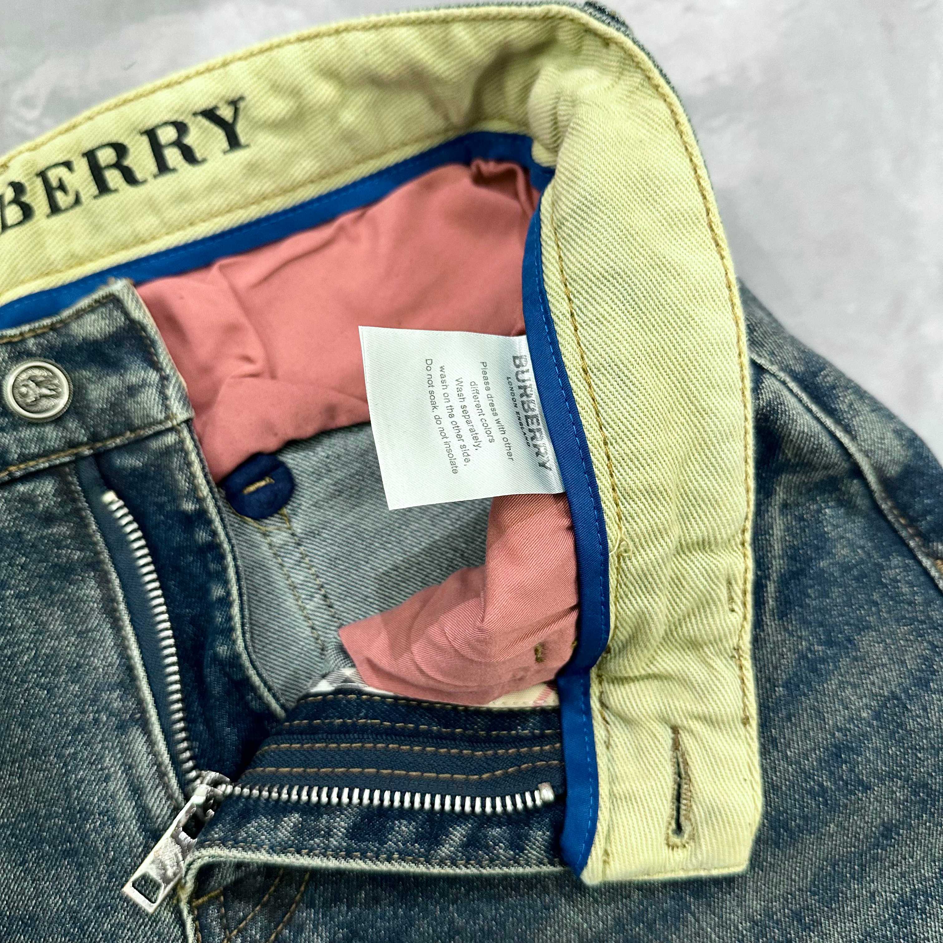 Burberry jeans waistband lining with pink fabric, inner label, and zipper